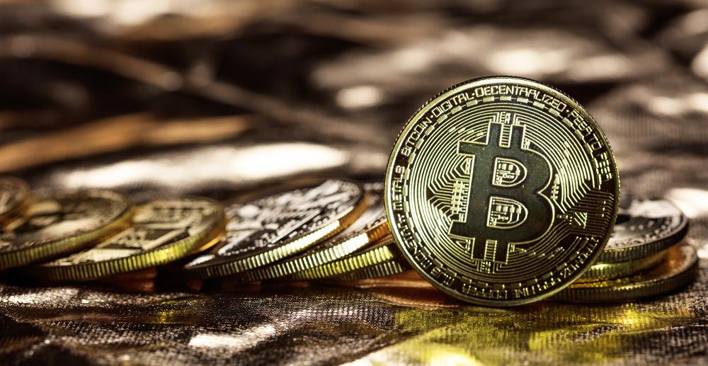 Bitcoin looking like coins spread out on a stack